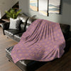 Fleece Blanket | Vibrant Mauve | On top of the sofa